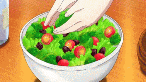 Person Making Salad With Vegetables GIF