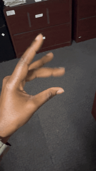 Person Making Triangle Hand Gesture GIF