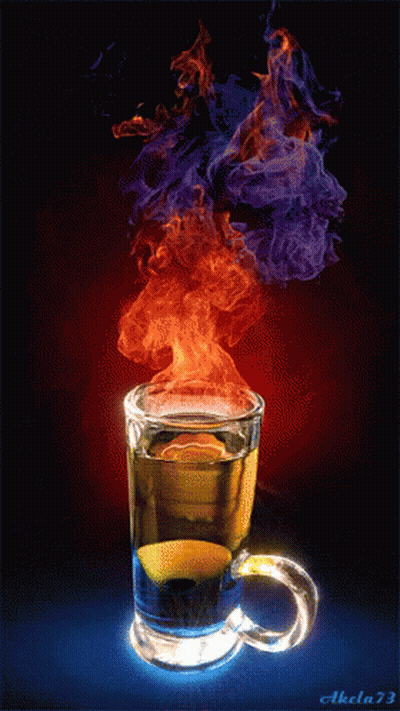 Person Mixing Drink With Spoon In Glass GIF
