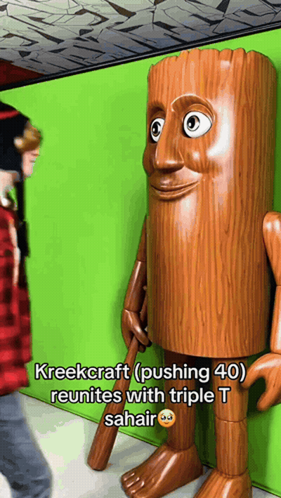 Person Next To Tree Trunk Statue GIF