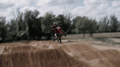 Person On Dirt Bike Jumping Over Hill GIF
