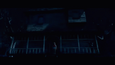 Person On Haunted House Porch GIF