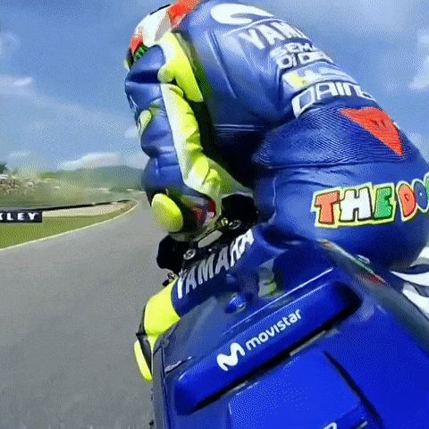 Person on Motorcycle With Movistar
