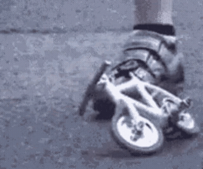 Person On Roller Skates Riding Bicycle GIF