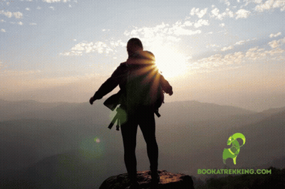 Person On Top Of Mountain With Bookatrekking.com Logo GIF