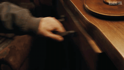 Person Opening Drawer With Resident Evil GIF