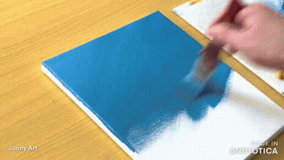 Person Painting Blue Square On Wooden Table Made In Aninotica GIF