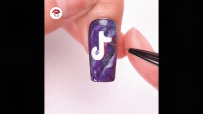 Person Painting TikTok Logo On Purple Nail GIF