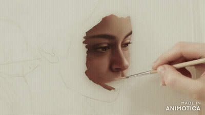 Person Painting Woman's Face With Brush GIF