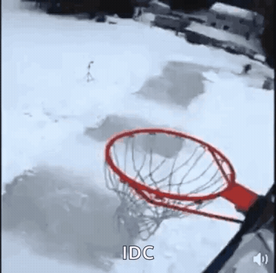 Person Playing Basketball In Snow Through Net GIF