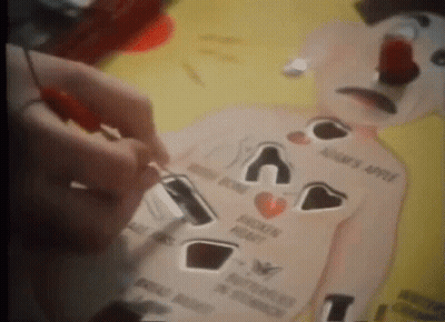 Person Playing Game With Broken Heart And Adam's Apple GIF