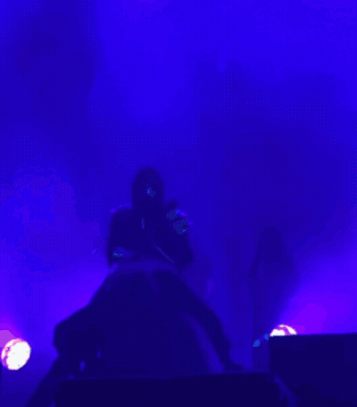 Person Playing Guitar In Dark Room With Purple Lights GIF