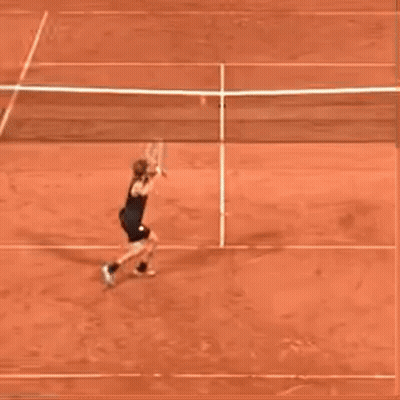Person Playing Tennis On Red Clay Court GIF