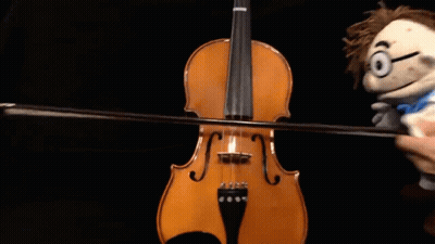 Person Playing Violin Next To Puppet GIF