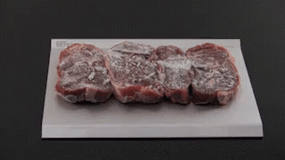 Person Pointing at Meat on Cutting Board