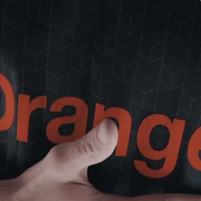 Person Pointing At Orange On Black Shirt GIF
