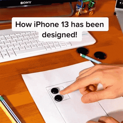 Person Pointing At Paper How IPhone 13 Has Been Designed GIF