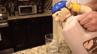 Person Pouring Chocolate Milk From Pitcher GIF