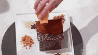 Person Pouring Chocolate On Cake GIF