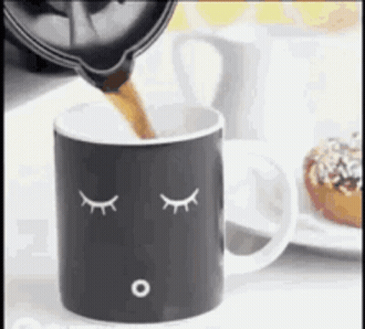 Person Pouring Coffee Into Face Mug GIF