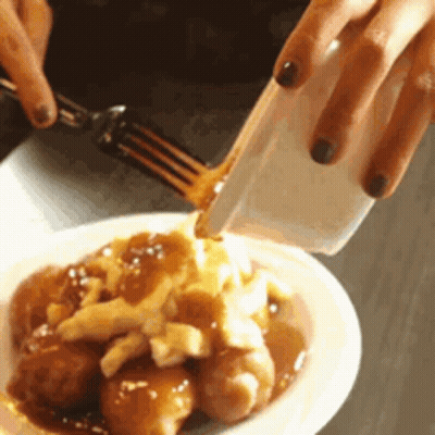 Person Pouring Gravy On Plate Of Food GIF