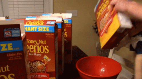 Person Pouring Honey Nut Cheerios Into Red Bowl GIF