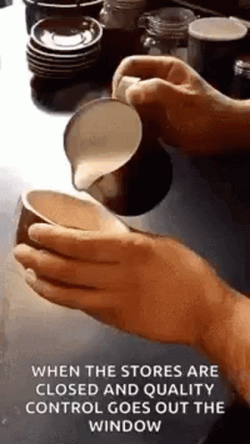 Person Pouring Milk Into Cup Of Coffee GIF