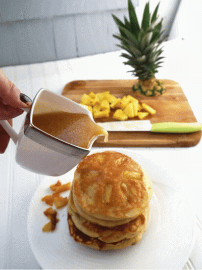 Person Pouring Sauce On Pancakes GIF