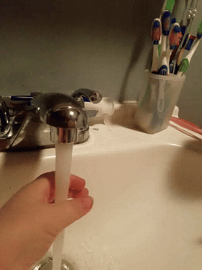 Person Pouring Toothpaste Into Faucet GIF