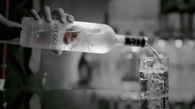 Person Pouring Vodka Into Glass GIF