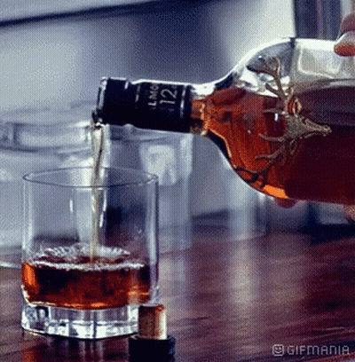 Person Pouring Whiskey From LMC 122 Bottle GIF
