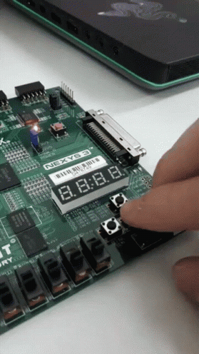 Person Pressing Button On Nexyb3 Board GIF