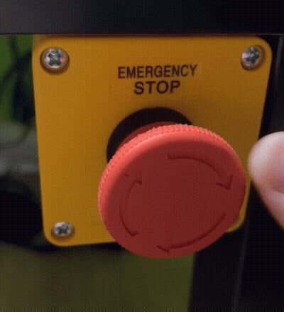 Person Pressing Emergency Stop Button On Yellow Box GIF