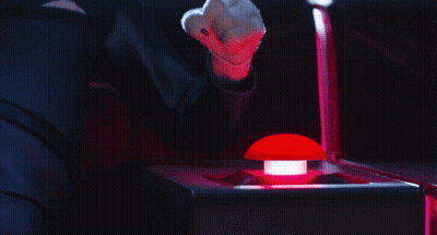 Person Pressing Red Button In Dark GIF