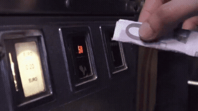 Person Putting Euro Bill Into Machine GIF