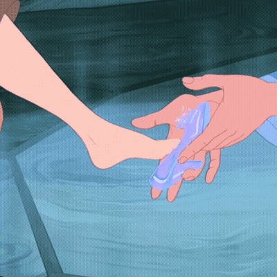 Person Putting Shoe On Another GIF