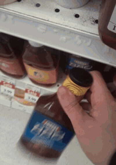 Person Reaching For Barbecue Sauce Bottle GIF