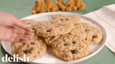 Person Reaching For Cookie Saying Delish GIF