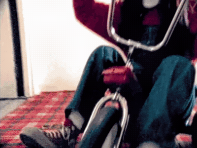 Person Riding Bicycle With Red Tire GIF