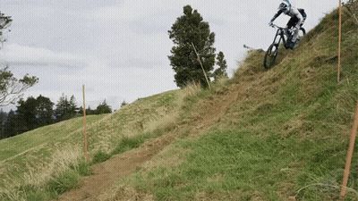 Person Riding Bike Down Hill