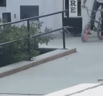 Person Riding Bike On Ramp With Re Sign GIF