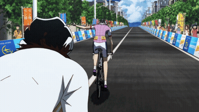 Person Riding Bike With Tokyo Marathon Banner GIF