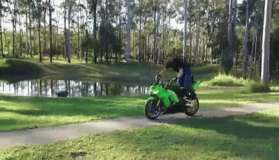 Person Riding Green Motorcycle On Path GIF