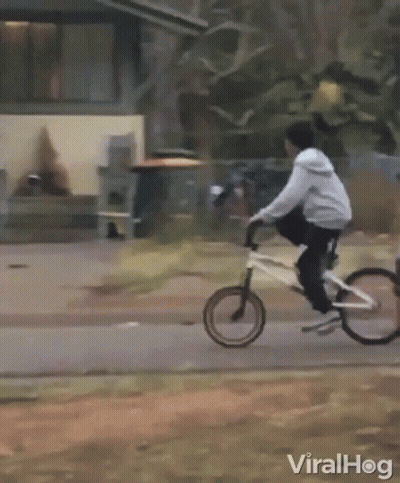 Person Riding Motorcycle Past Building Saying A & A GIF