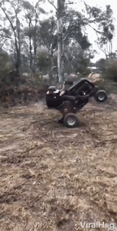 Person Riding Motorcycle Past Stop Sign GIF