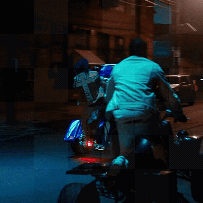 Person Riding Motorcycle With Cross On Back GIF