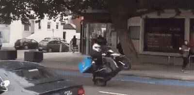 Person Riding Motorcycle With Domino's Pizza Bag GIF