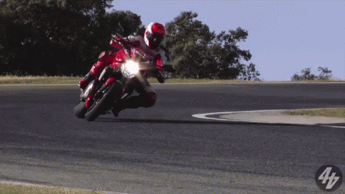 Person Riding Red Motorcycle With Number 4 GIF