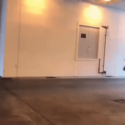 Person Riding Scooter In Garage GIF