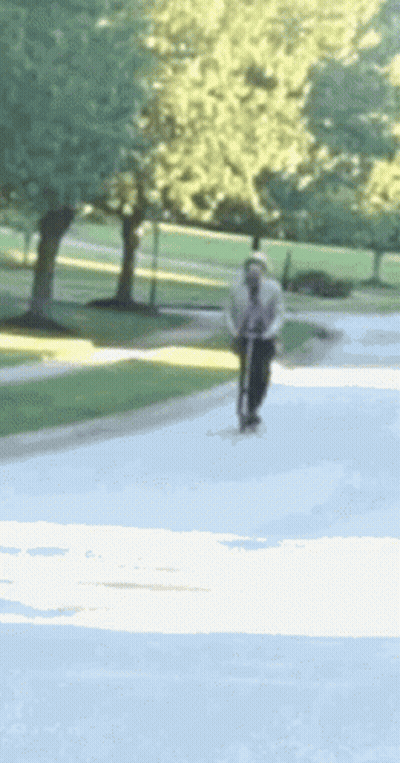 Person Riding Scooter GIF